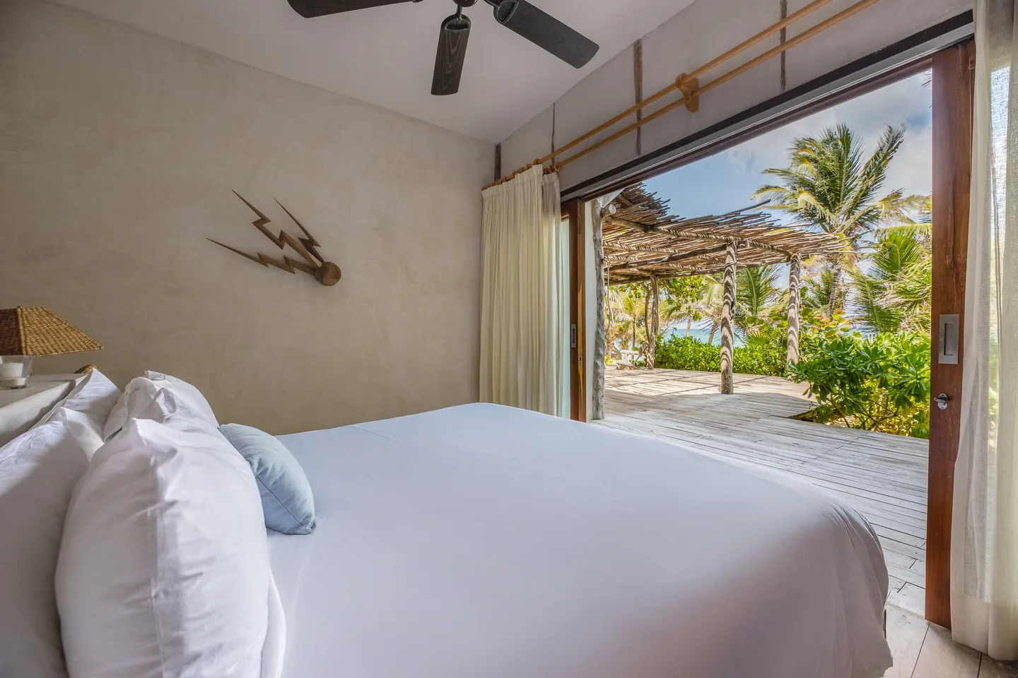 King bed opening straight onto the beach terrace — Odyssey Suite & Compass Suite, La Valise Tulum