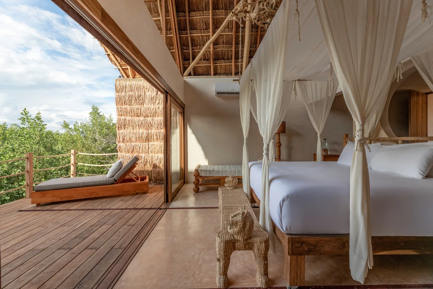 Rolling king bed opening onto the terrace above the jungle canopy — Ka’an Suite, Toucan Suite & Sunset Suite, La Valise Tulum
